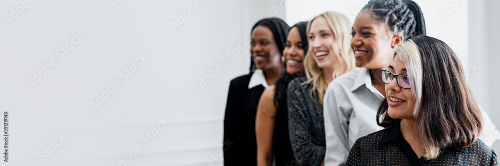 Diverse confident businesswomen standing together