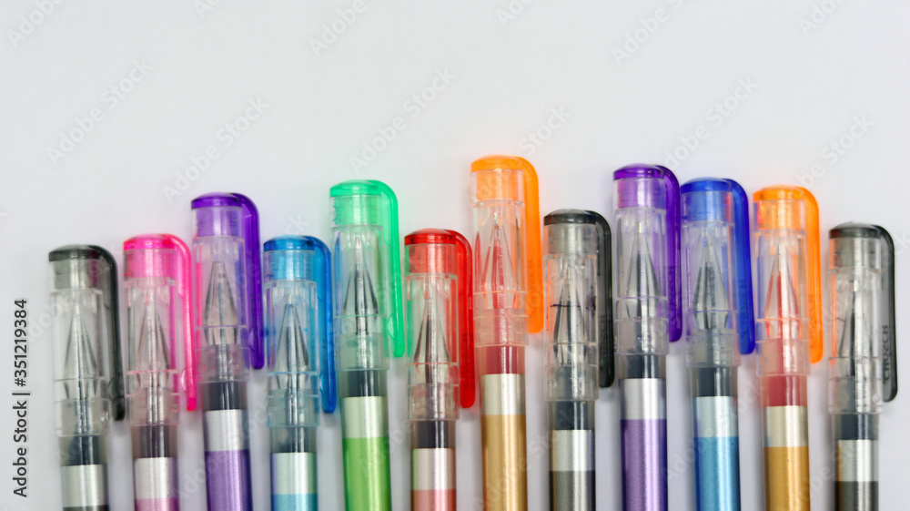 Close up colorful pens rainbow isolated in white background has copy space for text, using for studying in school class room, back to school template learning concept, can use as PowerPoint template. Close up colorful pens rainbow isolated in white background has copy space for text, using for studying in school class room, back to school template learning concept, can use as PowerPoint template.