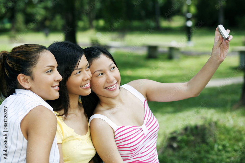 Women posing for a picture Women posing for a picture