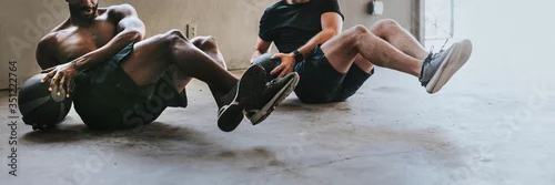 Obraz Sportive men working out with fitness balls