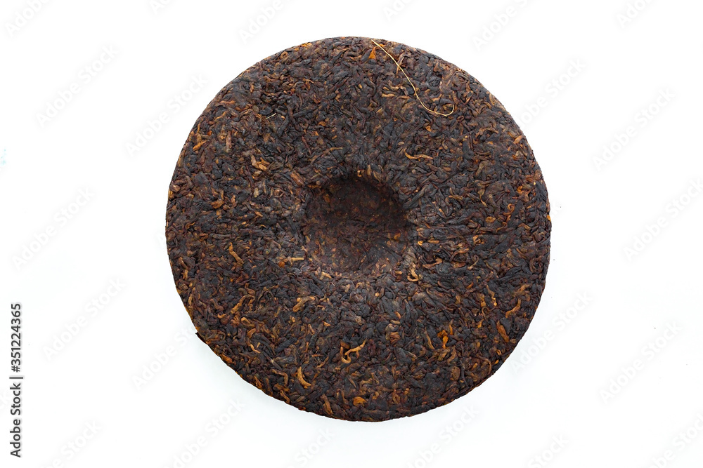 Puer tea in the form of tortillas on a white background, different varieties. Puer tea in the form of tortillas on a white background, different varieties.