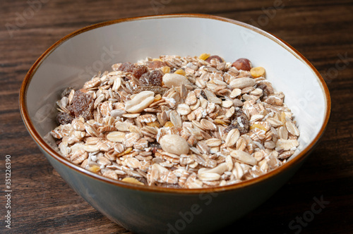 Ceramic bowl with oatmeals, muesli. Fast breakfast, healthy food Natural