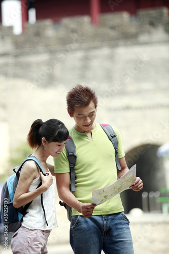 Man and woman looking at map