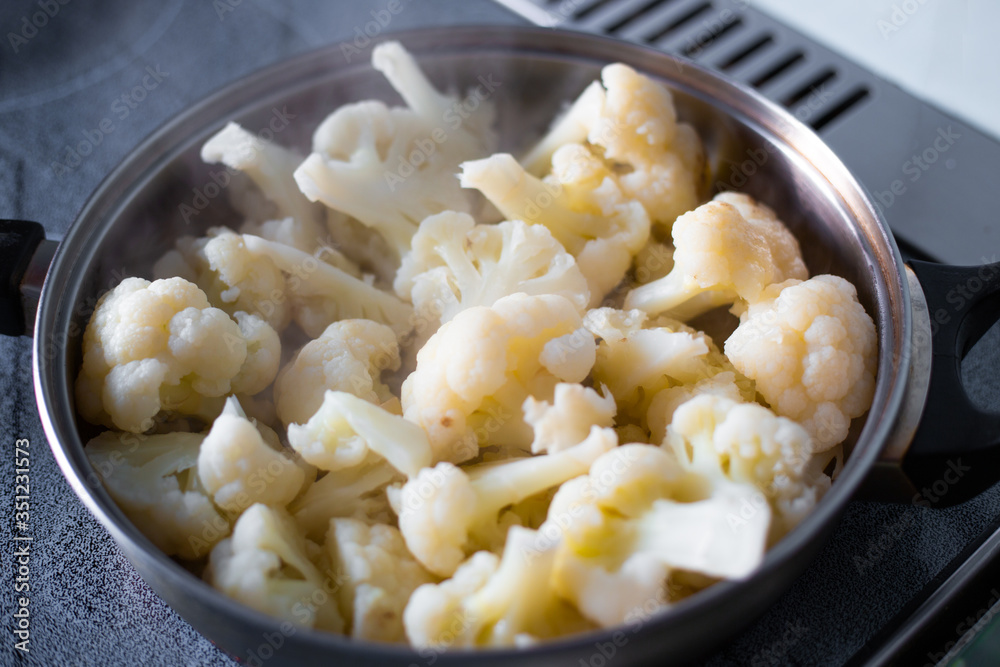 cauliflower inflorescences are cooked in a pan, tasty healthy vegetable food, cauliflower inflorescences are cooked in a pan, tasty healthy vegetable food,