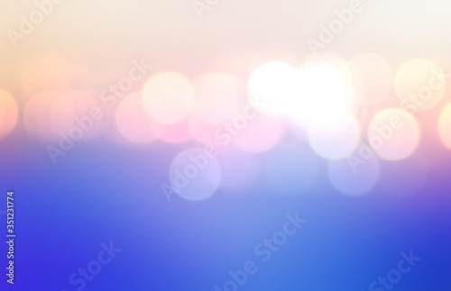 Holiday lights abstract pattern. Lilac blue pink yellow gradient background. Bright bokeh blur texture. 