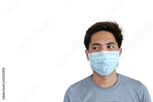 Asian man wear surgical mask to prevent air pollution , germs and coronavirus , White background.