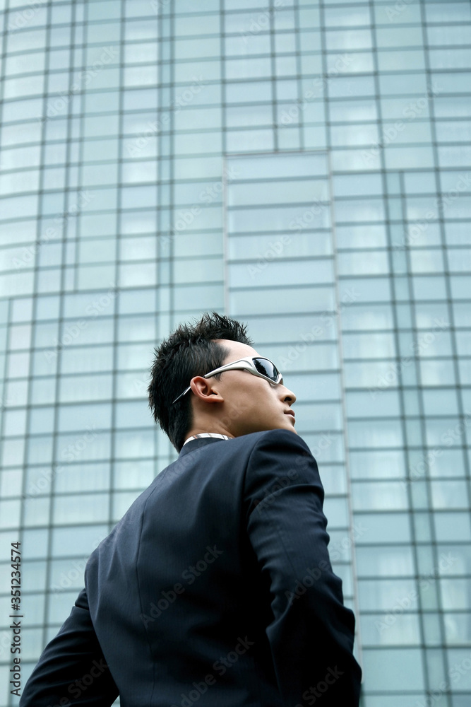 Businessman with sunglasses looking away Businessman with sunglasses looking away
