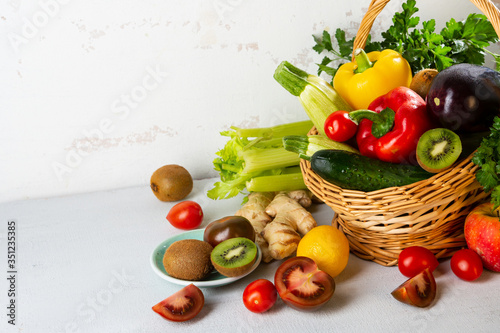 Fresh orgaic vegetables and fruits on white table photo