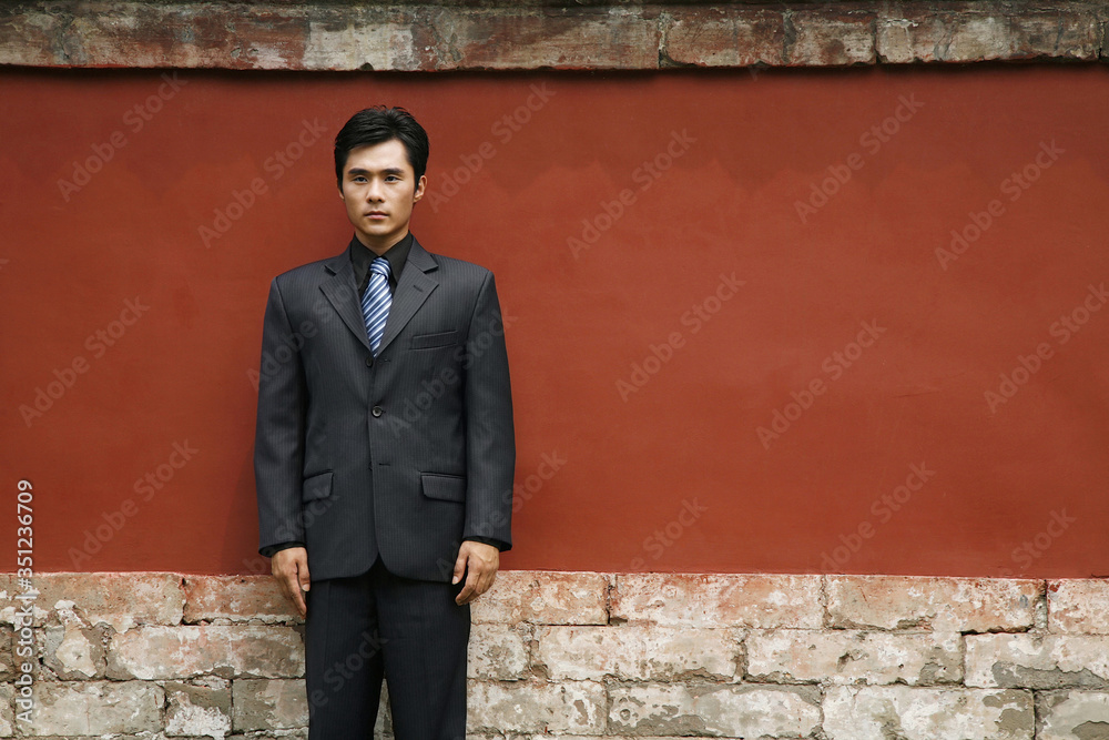 Businessman standing at attention Businessman standing at attention