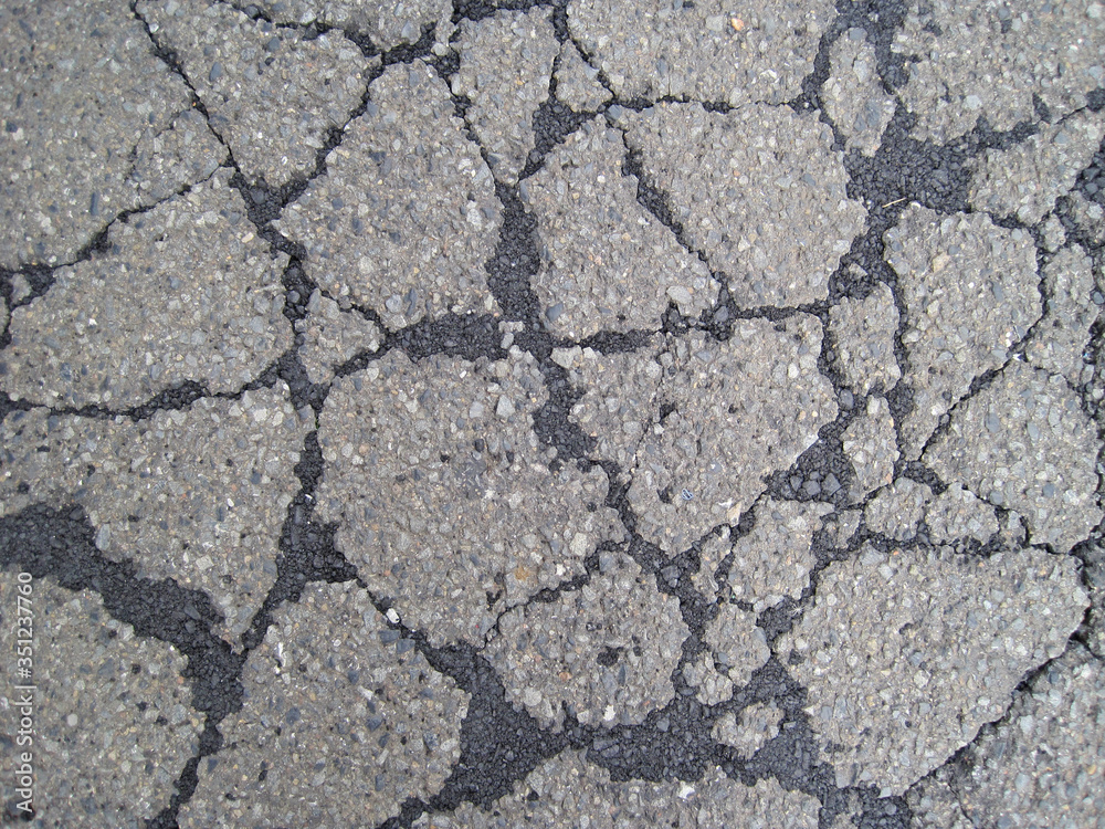Obraz premium Asphalt road with cracks repaired