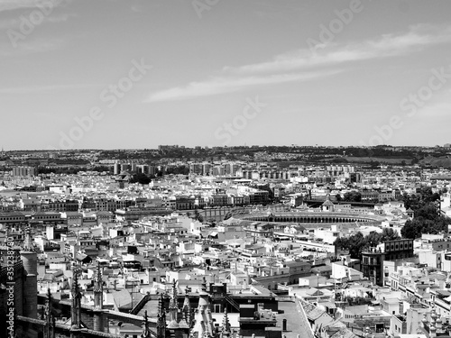 Hot summer day on the top of Sevilla. Great city view. Black and white.