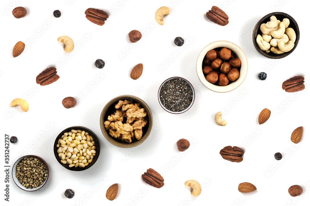 Nuts in round cup, top view close up. On white background. in round cup, top view close up. On white background. Nuts in round cup, top view close up. On white background. in round cup, top view close up. On white background.