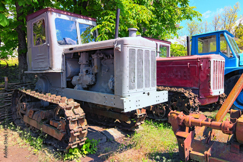 Panoramic view of vintage agricultural machinery. Vintage vehicles in Open-air Museum of Folk Architecture and Life of the Middle Naddnipryanshchyna in Pereyaslav, Ukraine photo