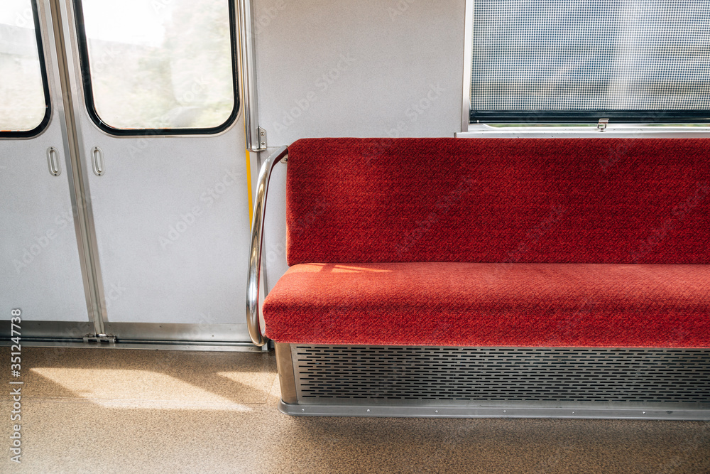 Interior of subway. Inside Japanese metro train. Empty seats and door