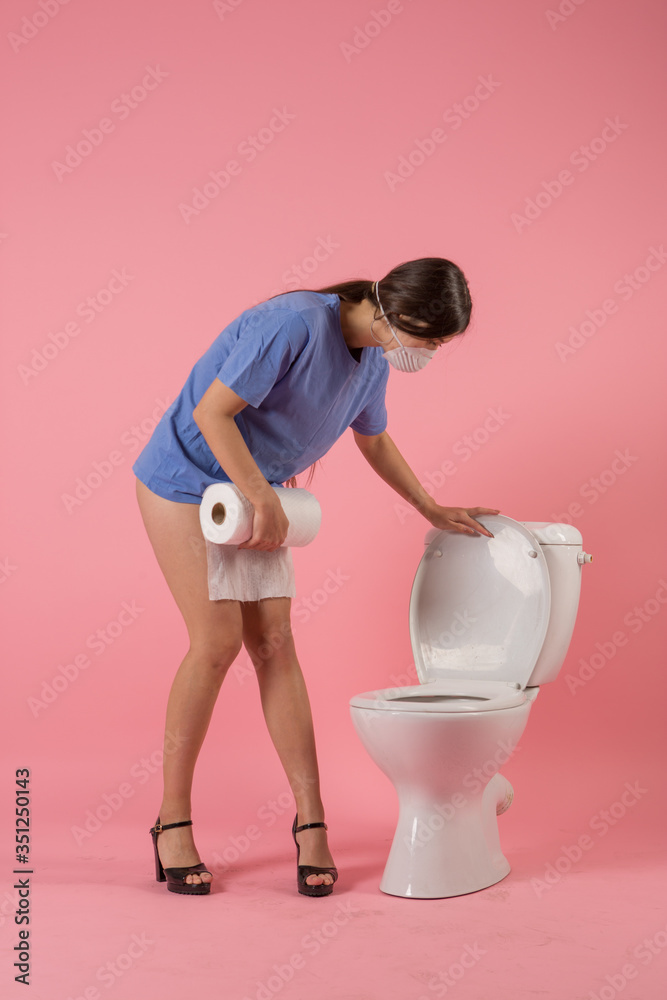 girl near the toilet with toilet paper girl near the toilet with toilet paper