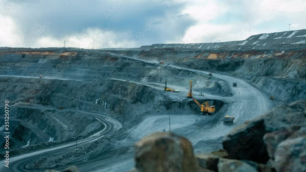 Timelapse video work of equipment on an open pit for gold mining
