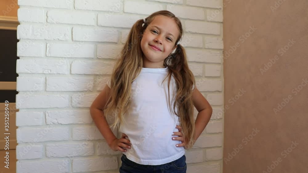 Funny little girl smiling looking at camera at home, cute kid talking to webcam making online video call or recording vlog having fun Funny little girl smiling looking at camera at home, cute kid talking to webcam making online video call or recording vlog having fun