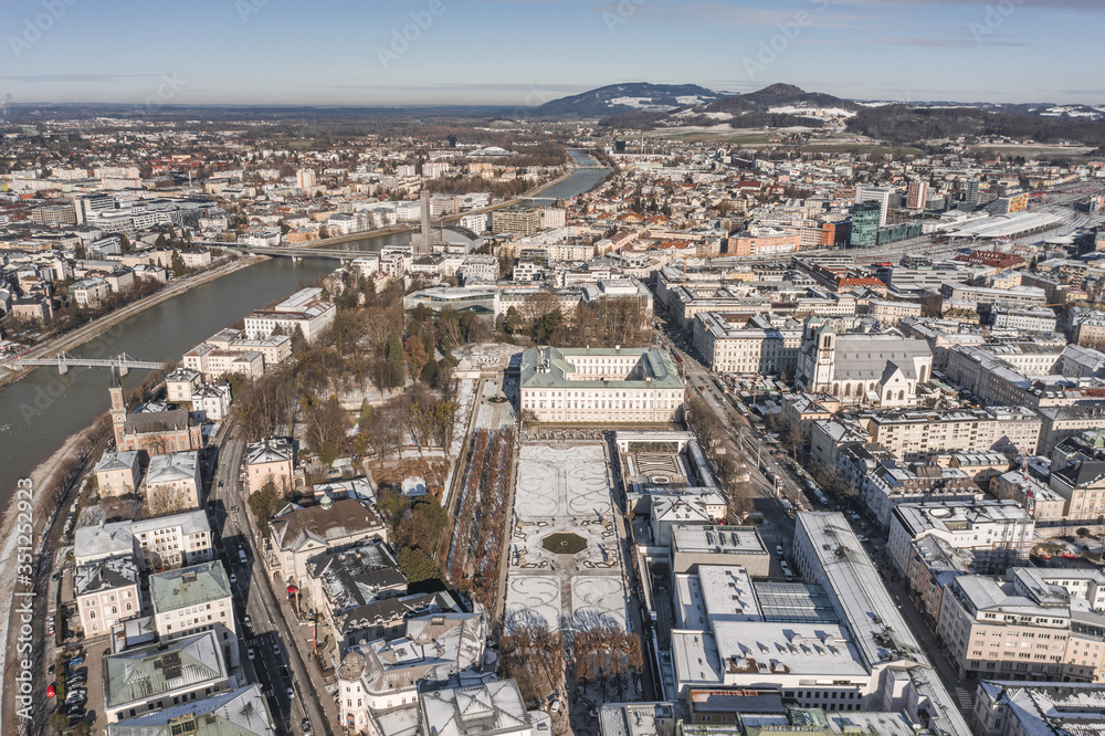 Aerial drone view of snowy Mirabelle Palace in Salzburg downtown center in winter morning
