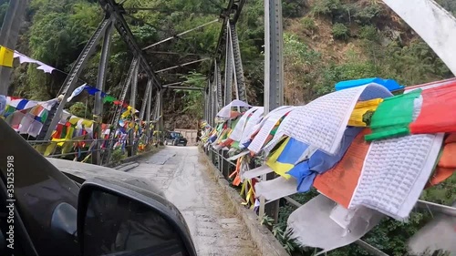 Bridge with prayer flags, Silk Route, Sikkim, India photo