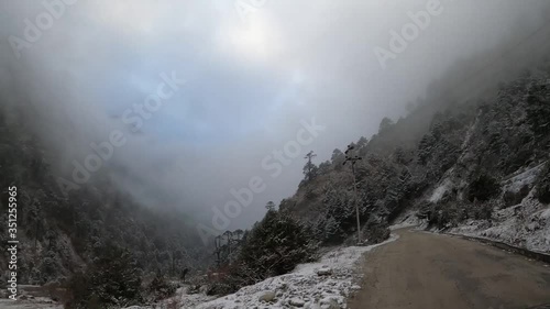 Road to Tangu in snowfall, Silk Route, Sikkim, India photo