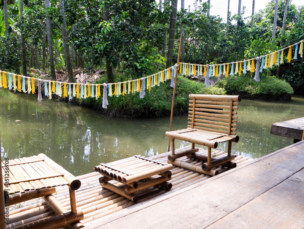 Chairs and bamboo rafts on the waterfront Chairs and bamboo rafts on the waterfront