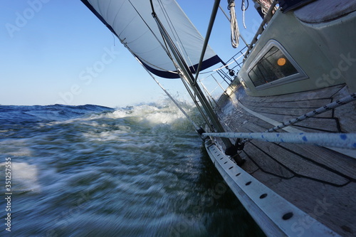 Sailing on a sailing boat with wind, waves and tube water.