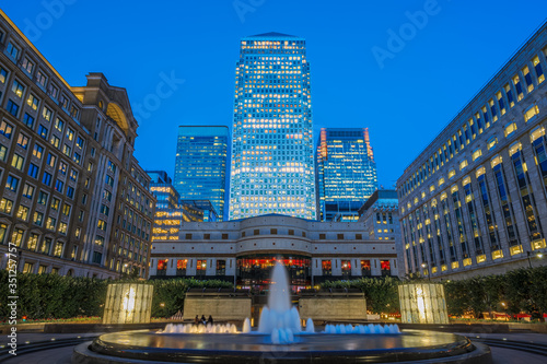 Illuminated Canary Wharf seen from Cabot Square in London photo