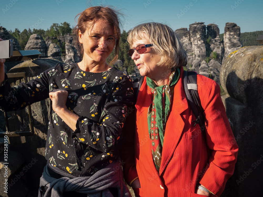 Fototapeta premium Two female women making a selfie