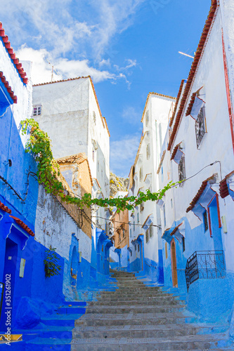 Empty narrow street in medina of Chefchaouen, Morocco. Blue pearl in the mountains of North Africa © Вера Тихонова