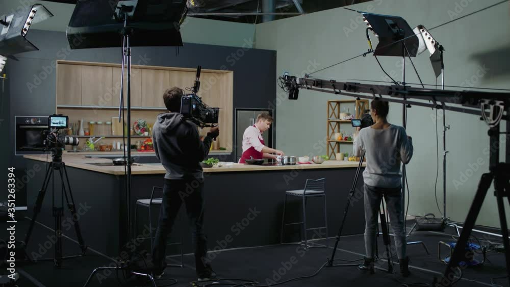 WIDE Behind the scenes of studio set, shooting TV television cooking show featuring celebrity chef, professional TV production. Shot on ARRI Alexa Mini
