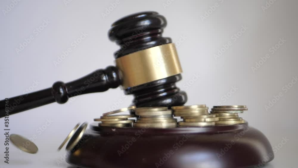 Gavel pownding at a financial or business lawsuit Gavel pownding at a financial or business lawsuit