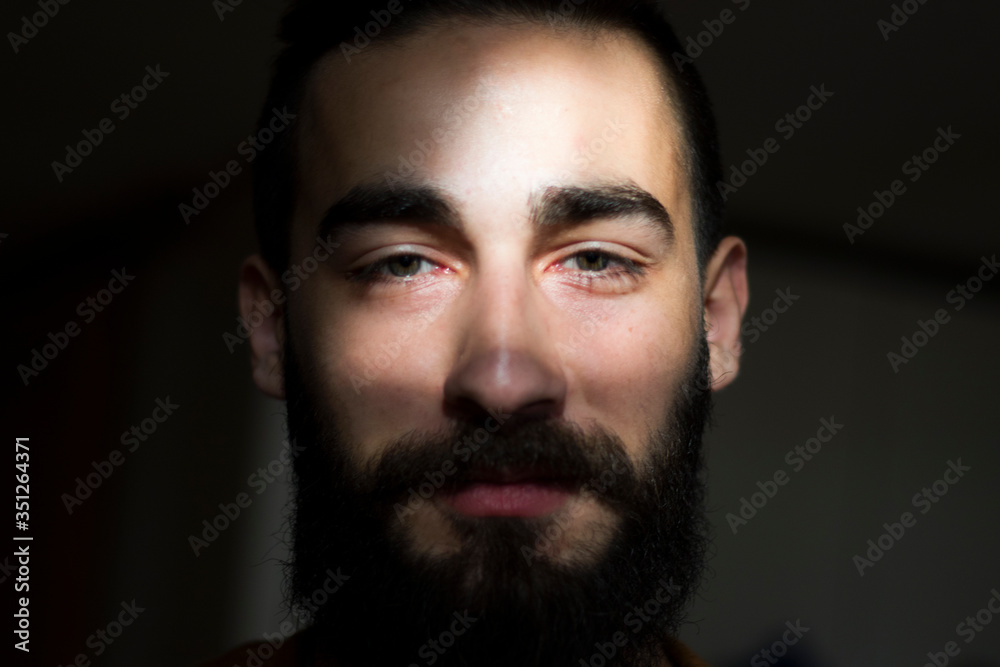 Man portrait, dark background, close up Man portrait, dark background, close up