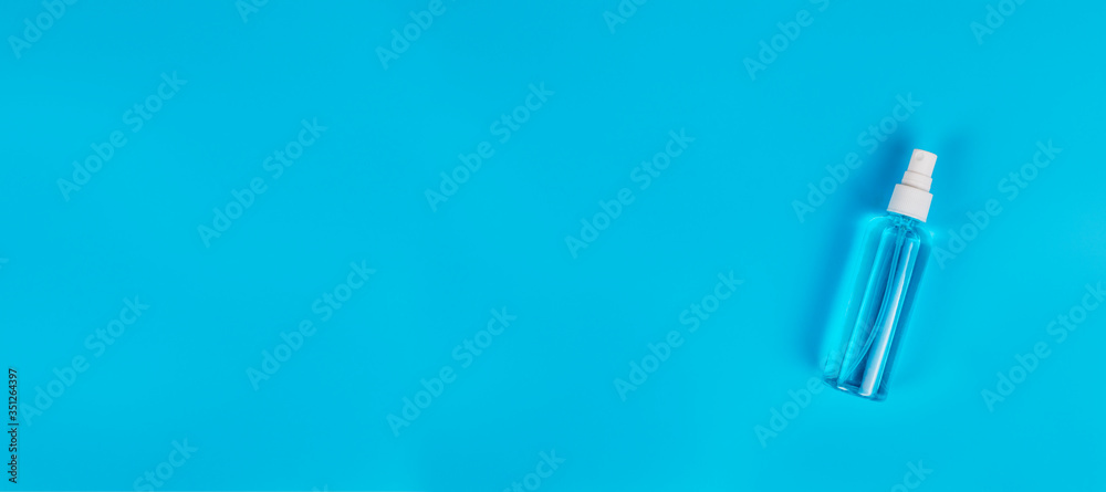 Blue alcohol isolated on blue background. Hand sanitizer for clean. Hand sanitizer in spray head bottle. with copy space. Blue alcohol isolated on blue background. Hand sanitizer for clean. Hand sanitizer in spray head bottle. with copy space.