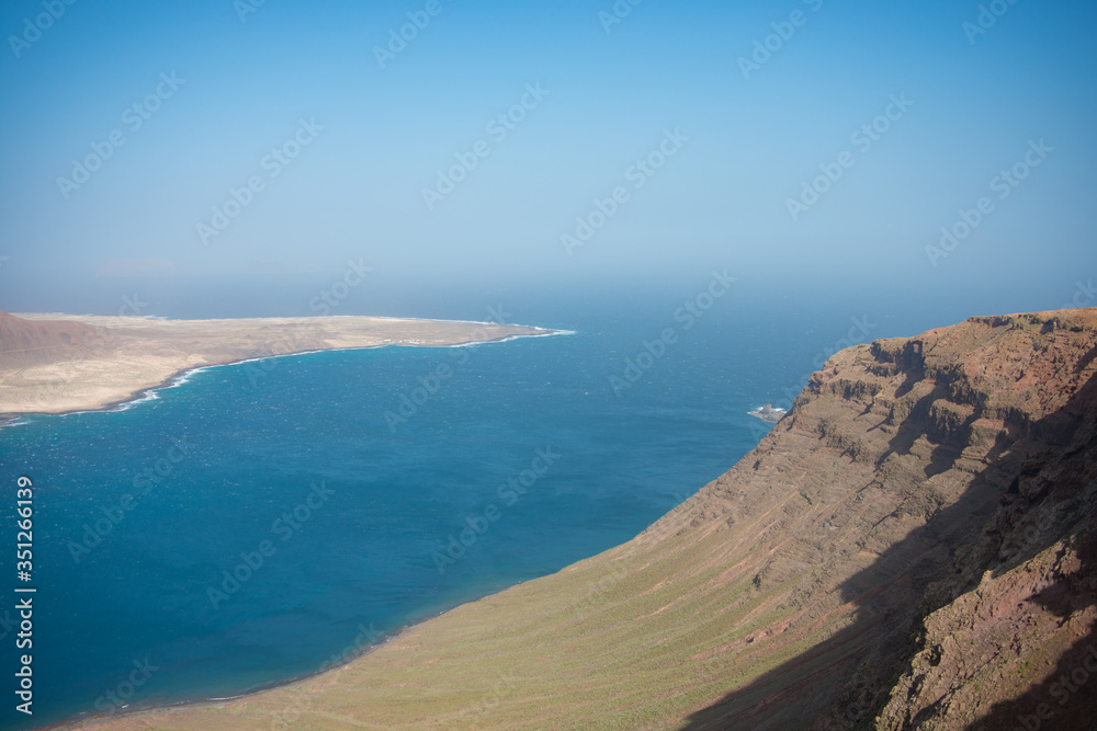 Aerial view on the coastline of Lanzarote island on a sunny day 