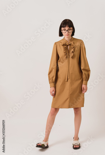 Fashion shooting in studio . Professional model , fashionable clothes and style, new collection. stylish look.