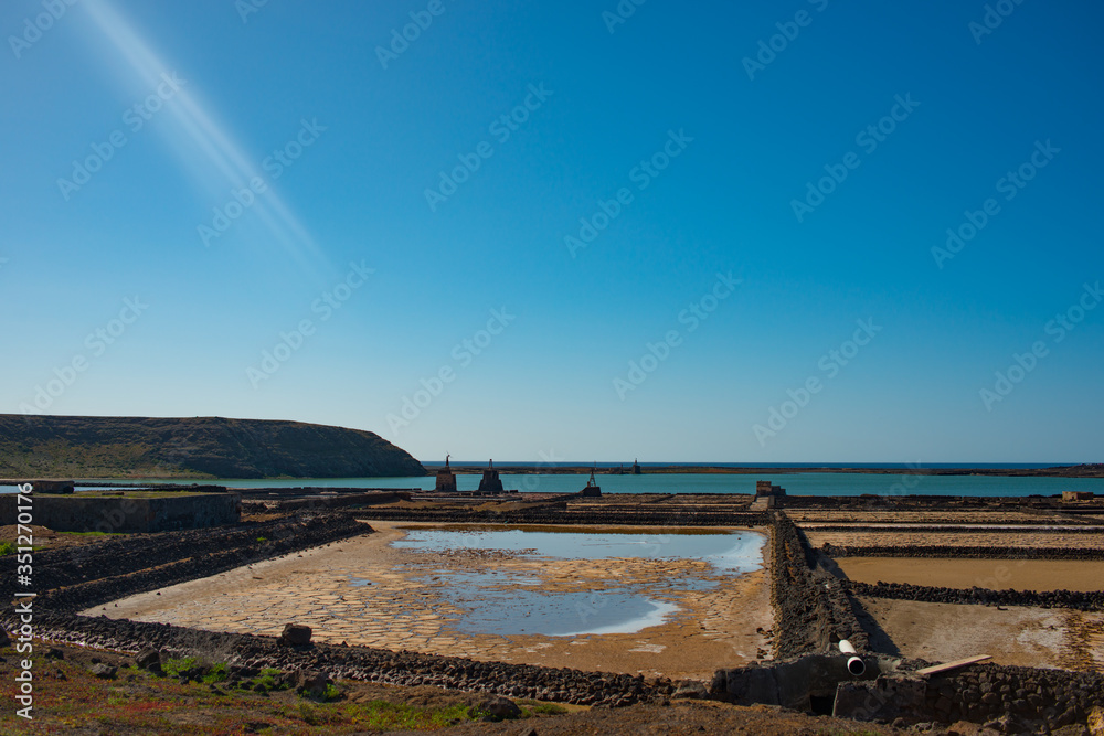 Aerial view on the salt production fields on Lanzarote island on a sunny day Aerial view on the salt production fields on Lanzarote island on a sunny day