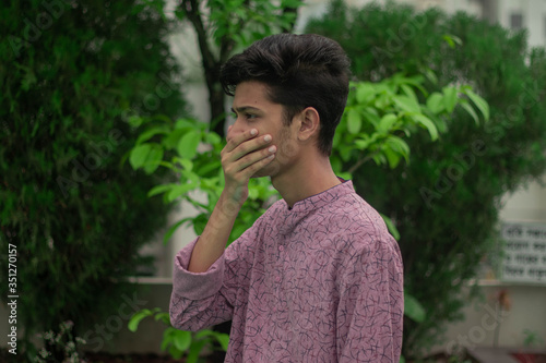 Arabian man wears mask to prevent covid 19.Iranian infected man wears safety face mask.Mask prevents corona virus and air pollution dust.New type coronavirus.Wearing mask and health sign