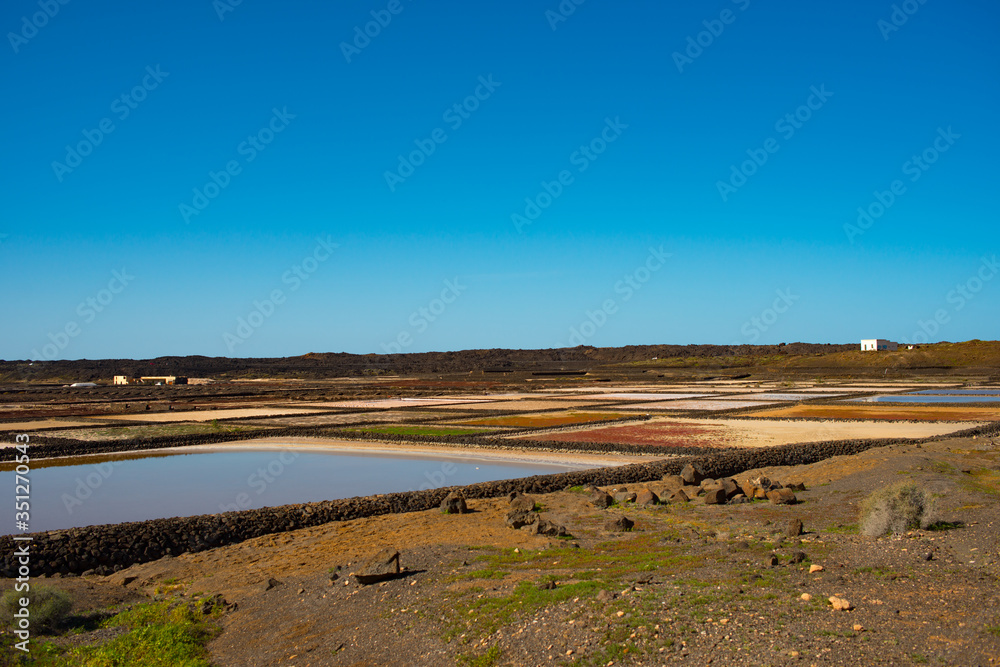 Aerial view on the salt production fields on Lanzarote island  on a sunny day 
