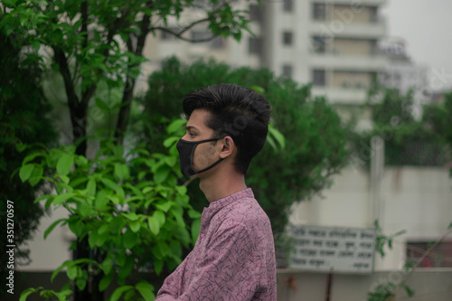 Arabian man wears mask to prevent covid 19.Iranian infected man wears safety face mask.Mask prevents corona virus and air pollution dust.New type coronavirus.