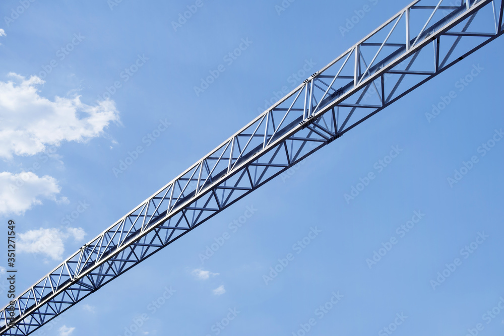 Metal construction on a background of blue sky.