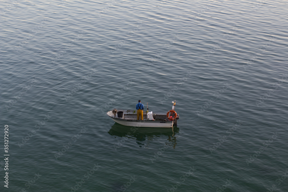 Fisherman on a small boat