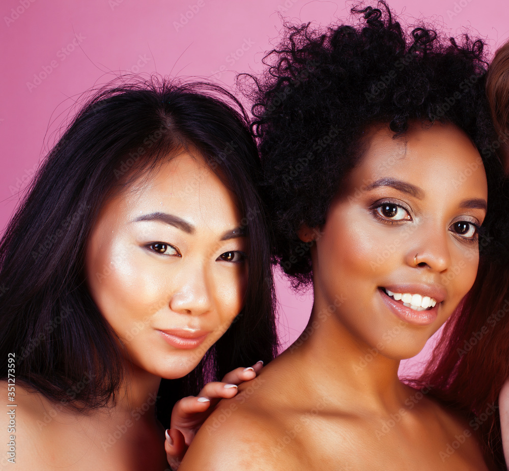 different nation girls with diversuty in skin, hair. Asian, scandinavian, african american cheerful emotional posing on pink background, woman day celebration, lifestyle people concept different nation girls with diversuty in skin, hair. Asian, scandinavian, african american cheerful emotional posing on pink background, woman day celebration, lifestyle people concept