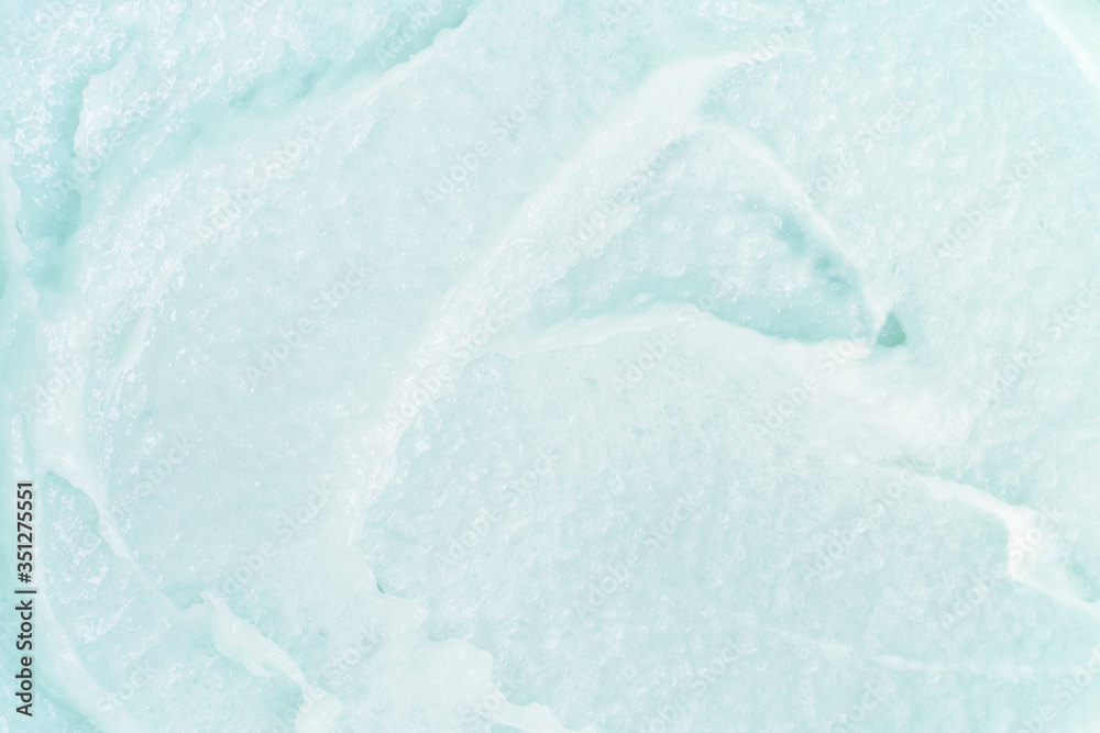 Obraz premium Сlose-up texture of a macro body cosmetic with a creamy blue scrub consistency. Beauty cosmetology macro background with copyspace.