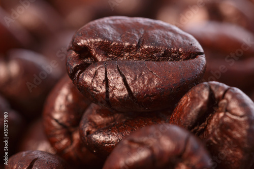 Dark roasted coffee beans  background   close up