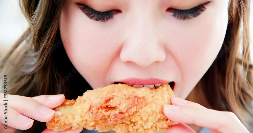 asian woman eat fried chicken