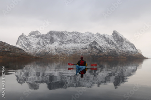 Kayaking on Reinefjorden in the Arctic Circle. 