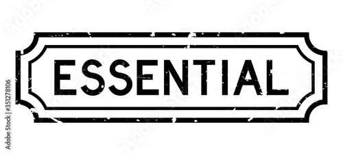 Grunge black essential word rubber business seal stamp on white background