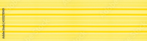 Yellow mustard white striped natural cotton linen textile texture background banner panorama 