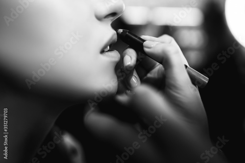 Make-up artist work in a beauty salon.  Makeup artist does makeup. Close-up of hands and cosmetics