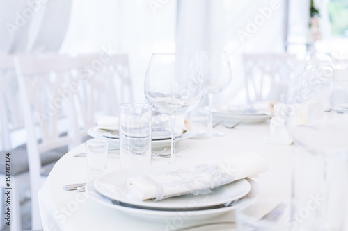 Wedding banquet. Table set for wedding reception © Nastya Tepikina